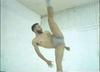 Man stretching legs to ceiling