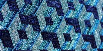 3D-effect geometric glittery pattern in blue hues