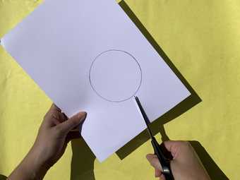 Image of a circle being cut out of card