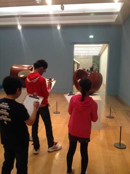 Young people drawing in the galleries at Tate Britain