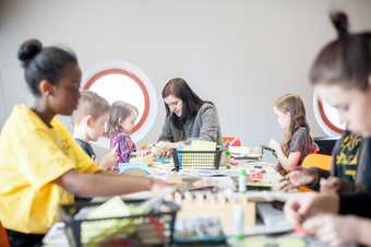 Families making art in a workshop