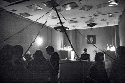 Inside Galerie Im Regierungsviertels Forgotten Bar Berlin photograph an interior filled with people and a bar with a bar tender