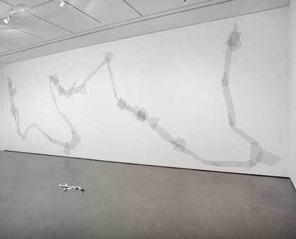 Installation view from the exhibition Art Now: David Musgrave, showing Giant torn tape figure (grey) 2003 and Paper golem 2003