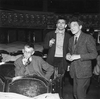 Black and white photograph of Samuel Beckett, Jean-Marie Serreau and Alberto Giacometti assisting at a rehearsal of Waiting for Godot, Théâtre de l'Odéon, Paris 1961