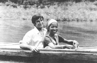 monochrome photo of Jack Gerrity and Pacita Abad smiling on a boat