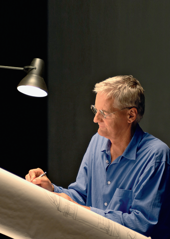 James Dyson working at his drawing board