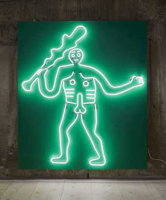 A male figure holding a stick created using neon lights