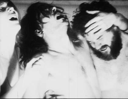 Image of three people, looking manic.