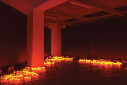 Jill Magid I can burn your face 2008 neon words installed on the floor of a darkened gallery making the room look like it is on fire