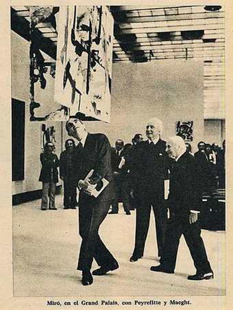Page from Triunfo magazine 8 June 1974 showing the Minister for Cultural Affairs Alain Peyrefitte walking under a Burnt Canvas with collector Aime Maeght and Joan Miro at the artists retrospective