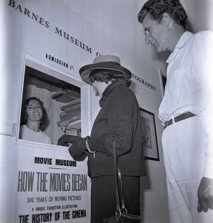 Archive photo of John Barnes and Garlick Barnes buying a ticket at the ticket office in 1962.