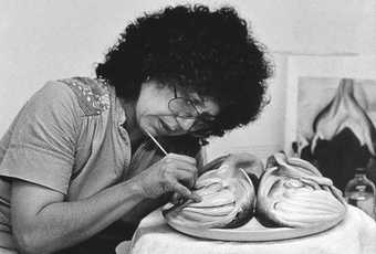 Judy Chicago working on the Georgia O'Keeffe plate for The Dinner Party, c.1976