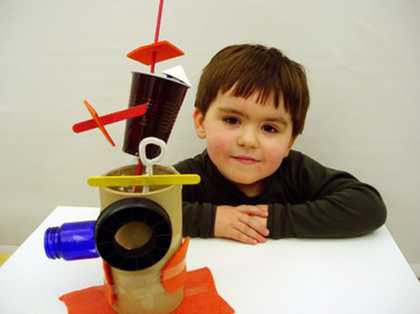 Boy with sculpture he has made