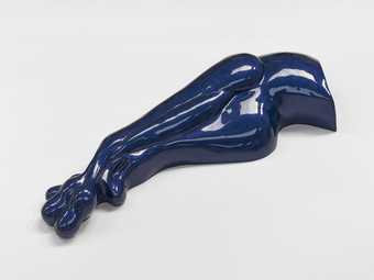 blue sculpture made of shiny material 