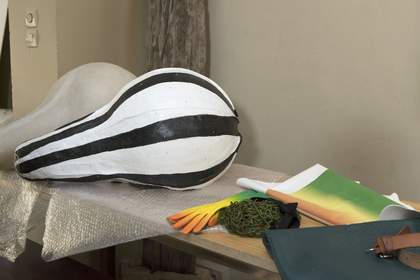 Glove and cod piece on a table.