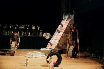 Photograph of 2 performers interacting with installation of sculptures by Kemang Wa Lehulere courtesy of the artist and Marian Goodman Gallery