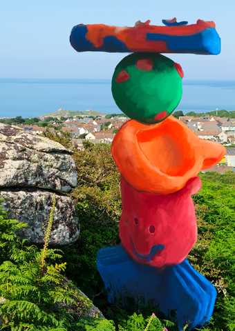 a plasticine-like scuplure, created digitally is situated in a beach landscape in St Ives
