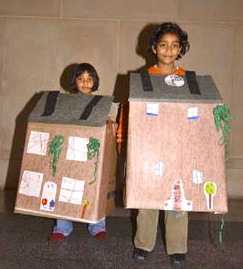 Kids wearing their house creations
