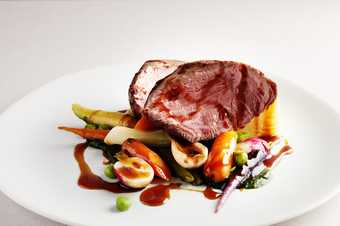 lamb herdwick with vegetables on a plate