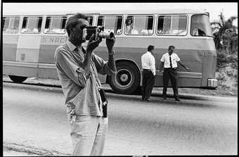 Photograph of Wifredo Lam filming during a tour of Cuba