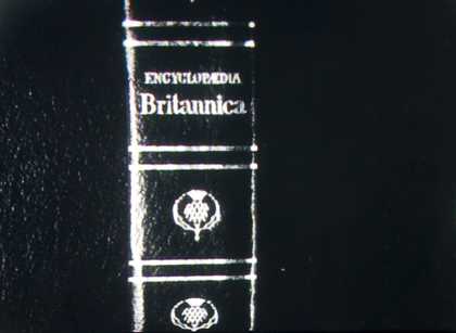 A black and white photocopy of the spine of a book.