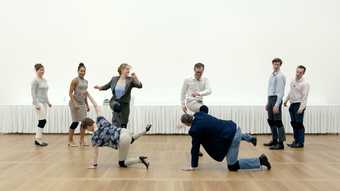 photograph of people dancing in a white gallery space