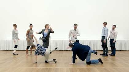 photograph of people dancing in a white gallery space