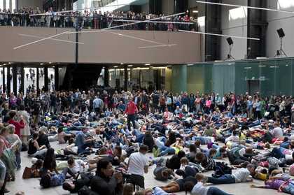 visitors are on the floor following dance and warm up instructions by Boris
