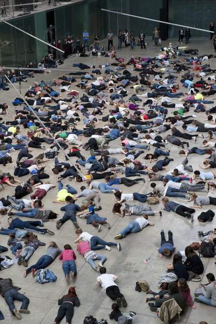 visitors are on the floor following dance and warm up instructions by Boris