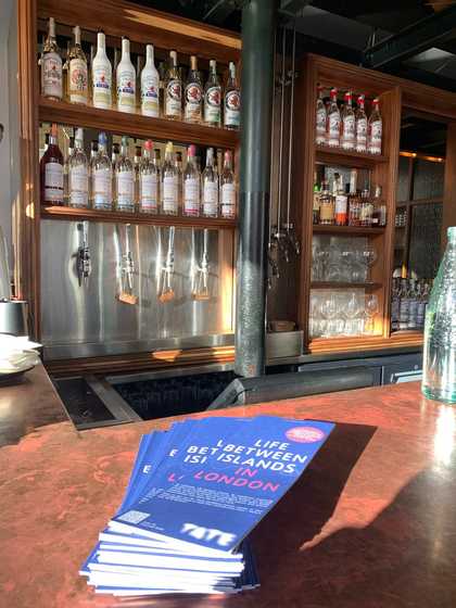 Stack of foldout map leaflets on the bar of a pub
