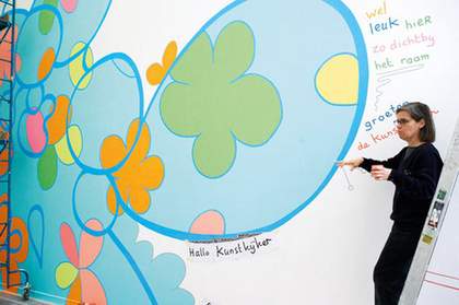 Lily van der Stokker painting Greetings, The Artist at MuHka, Antwerp 2005