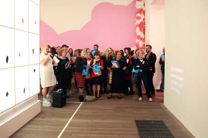 A group of teachers watching a performance in a gallery