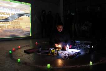 Person sitting on the floor performing