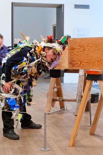 Artist-led schools workshop at Tate Modern, boy looking into box