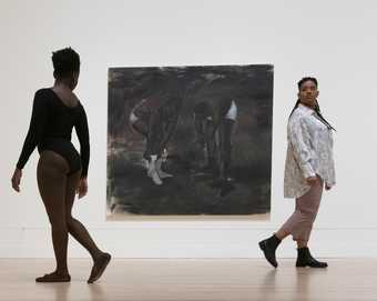 two people are walking away on either side of a Lynette Yiadom-Boakye piece called The Generosity