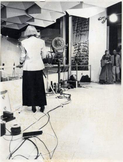 Lynn MacRitchie videoing the festival opening ceremony, RCA. Photographer unknown © Lynn MacRitchie