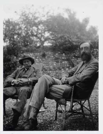 Photograph of Clive Bell and Lytton Strachey in the garden at Charleston © Tate Archive