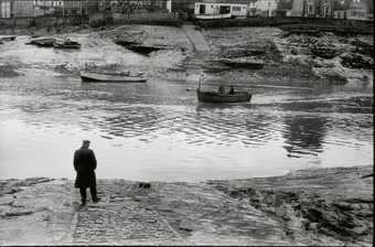 Richard Long standing left in boat crossing the River Avon on the Pill Ferry in march 1969