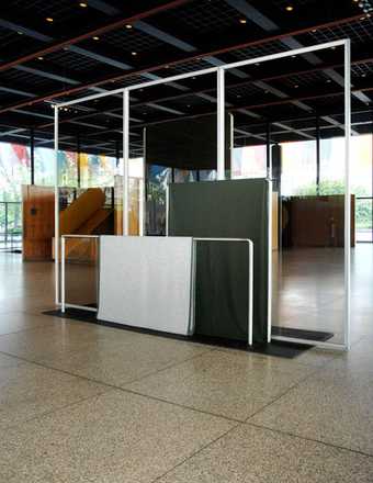Goshka Macuga Haus der Frau 1 2007 rectangular steel structures with fabrics draped over them with 
