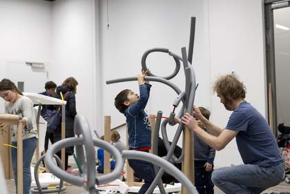 children making structures from foam tubes