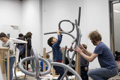 children making structures from foam tubes