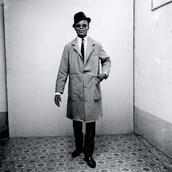 Malick Sidibé Man in Business-dress, like a pedestrian 1964
