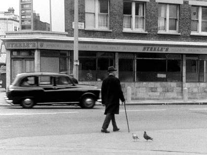 John Smith The Girl Chewing Gum 1976 (film still) man with cane