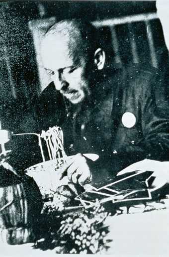 Filippo Tomaso Marinetti eating spaghetti in the late 1930s