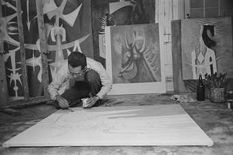 Photography of Wifredo Lam in his studio in Havana