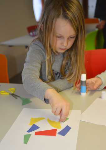 Kid arranging shapes