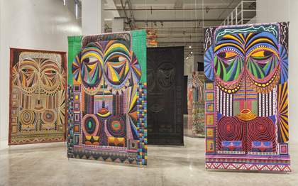 installation view of Pacita Abad's European Masks series