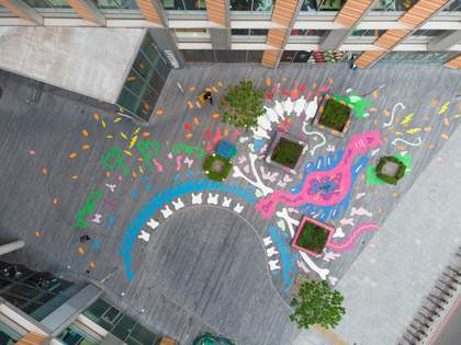birds eye view of a mural of abstract shapes painted on the ground