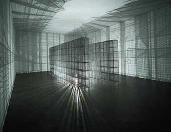 Mesh locker installation with a light placed in the middle to create mesh shadows on the gallery walls