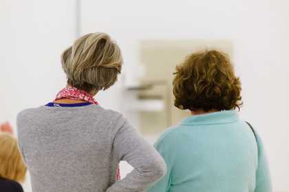 Image of two womens backs